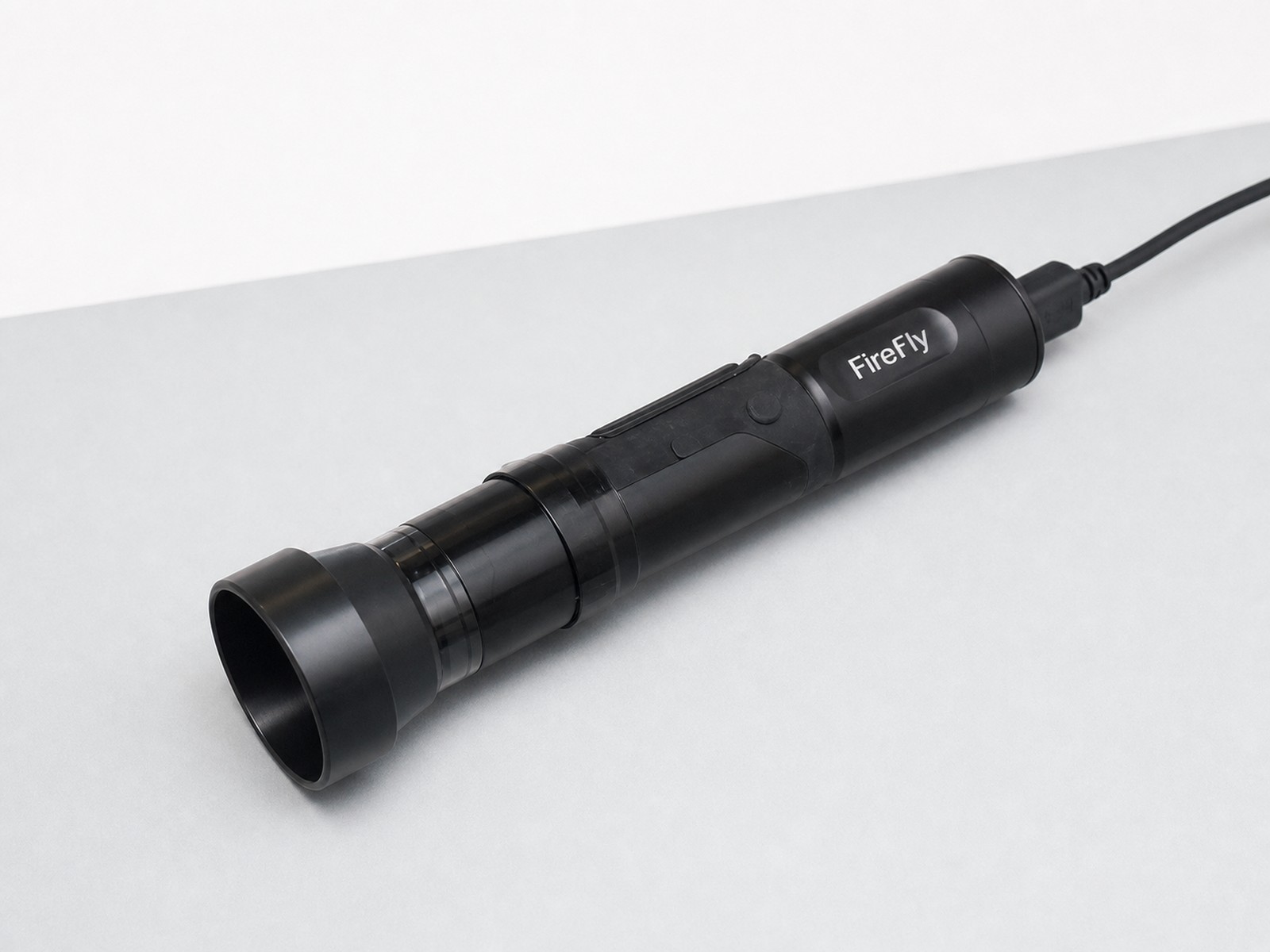 Firefly USB General Exam Scope photographed in a clean clinical studio setting