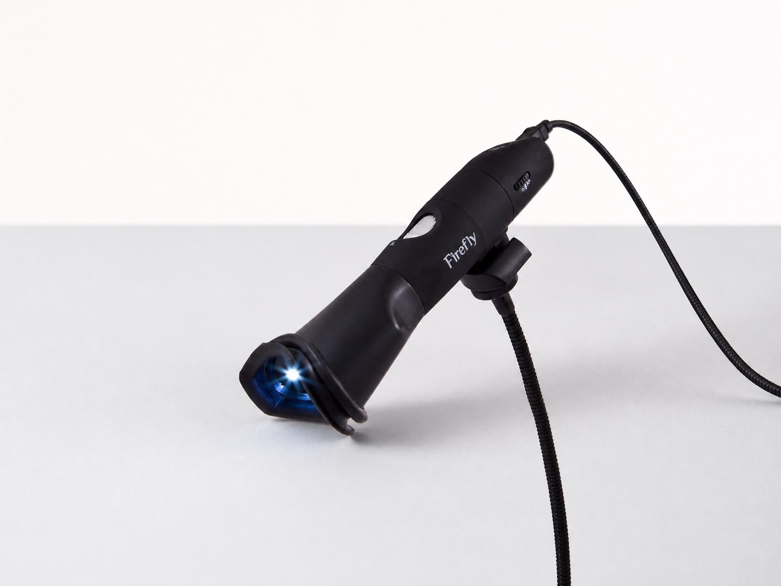 Firefly USB Iris Scope photographed in a clean clinical studio setting