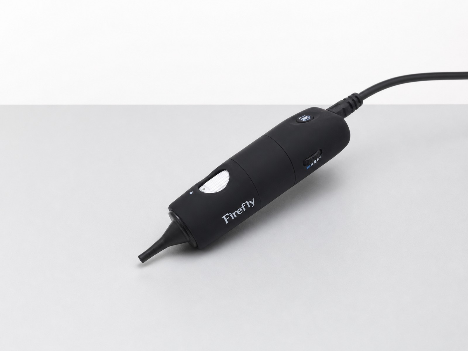 Firefly USB Otoscope photographed in a clean clinical studio setting